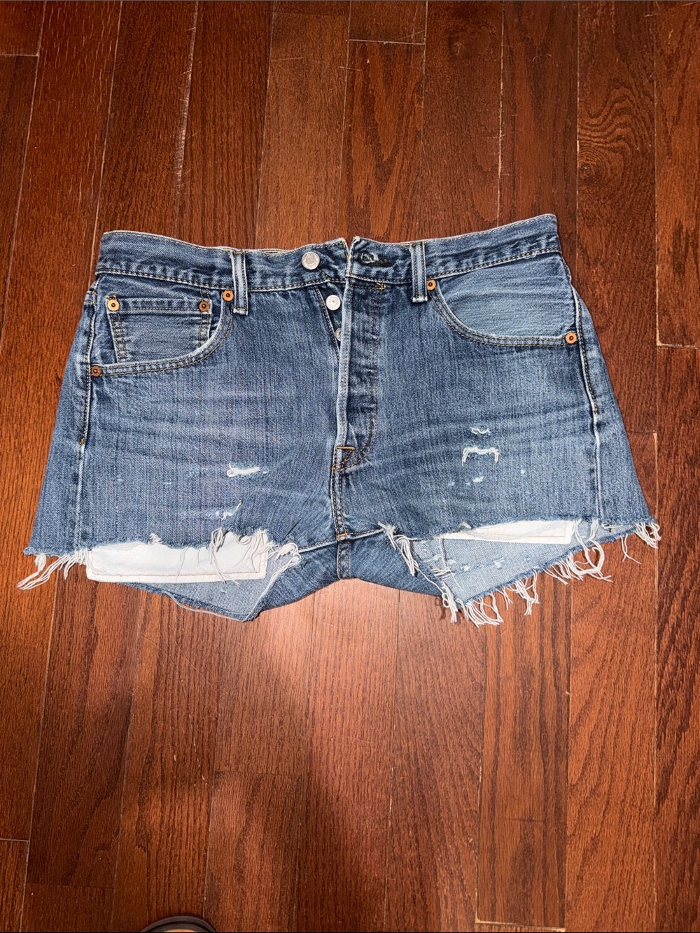 Levi's 501 Distressed Cutoff Jean Shorts in Medium Blue